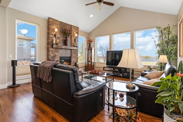 2468 E Lodge Trail Dr, Meridian, ID 83642 - living room with a stone fireplace, a ceiling fan, dark wood finished floors, recessed lighting, and high vaulted ceiling