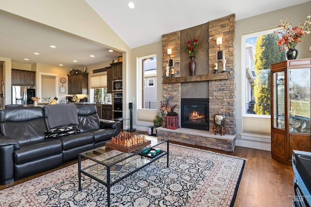 2468 E Lodge Trail Dr, Meridian, ID 83642 - living room with a stone fireplace, recessed lighting, wood finished floors, and lofted ceiling
