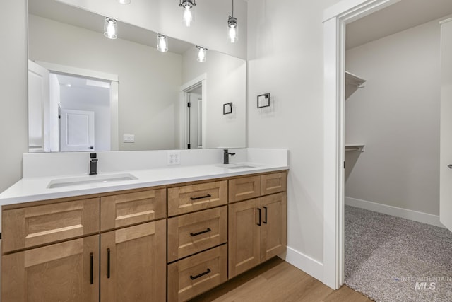 bathroom with vanity and hardwood / wood-style floors