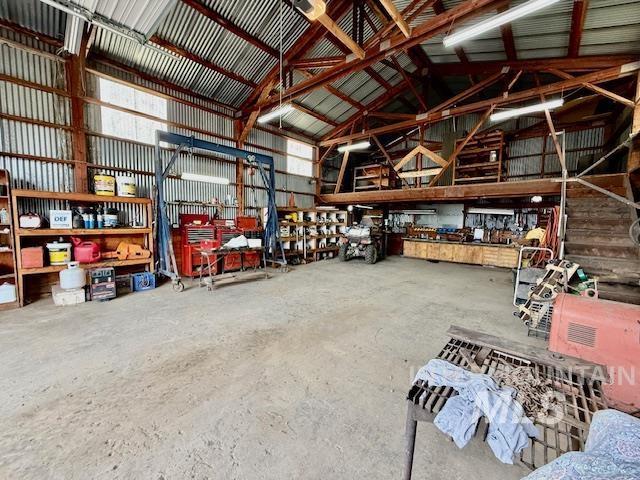908 Pine St, Anatone, WA 99401 - garage featuring a workshop area and metal wall