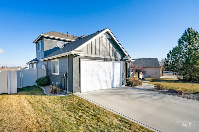 view of side of home with a garage and a yard