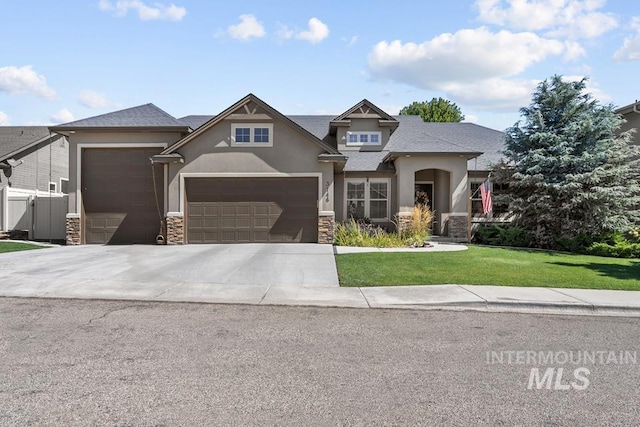 craftsman-style house featuring stucco siding, concrete driveway, a garage, stone siding, and a front lawn