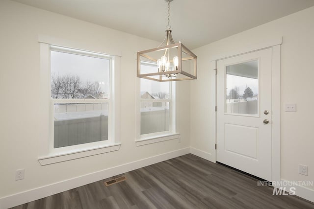 TBD Drum Ln Lot 3A, Parma, ID 83660 - unfurnished dining area featuring a chandelier, dark wood-type flooring, and baseboards