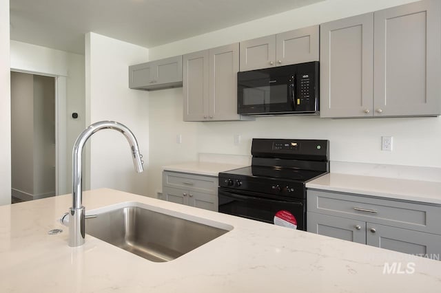 TBD Drum Ln Lot 3A, Parma, ID 83660 - kitchen featuring black appliances, gray cabinetry, a sink, and light stone countertops