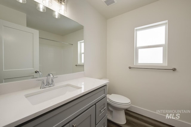 TBD Drum Ln Lot 3A, Parma, ID 83660 - bathroom featuring vanity, toilet, wood finished floors, baseboards, and a shower