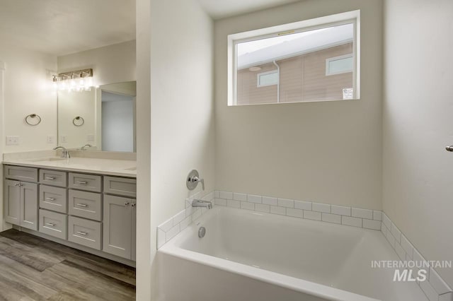 TBD Drum Ln Lot 3A, Parma, ID 83660 - bathroom with double vanity, a garden tub, and wood finished floors