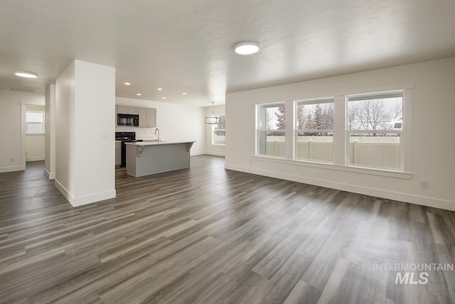 TBD Drum Ln Lot 3A, Parma, ID 83660 - unfurnished living room featuring baseboards, dark wood finished floors, and recessed lighting