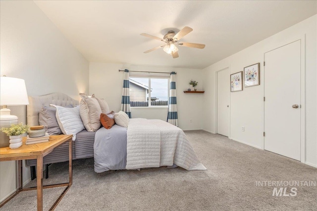 carpeted bedroom with ceiling fan