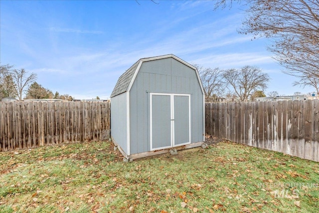 view of outbuilding featuring a yard