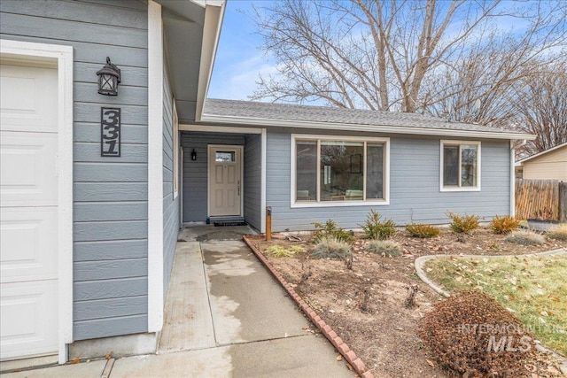 entrance to property featuring a garage