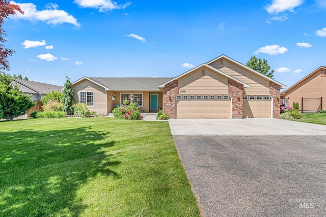 1305 N Autumn Wind Dr, Nampa, ID 83687 - ranch-style home with driveway, an attached garage, and brick siding