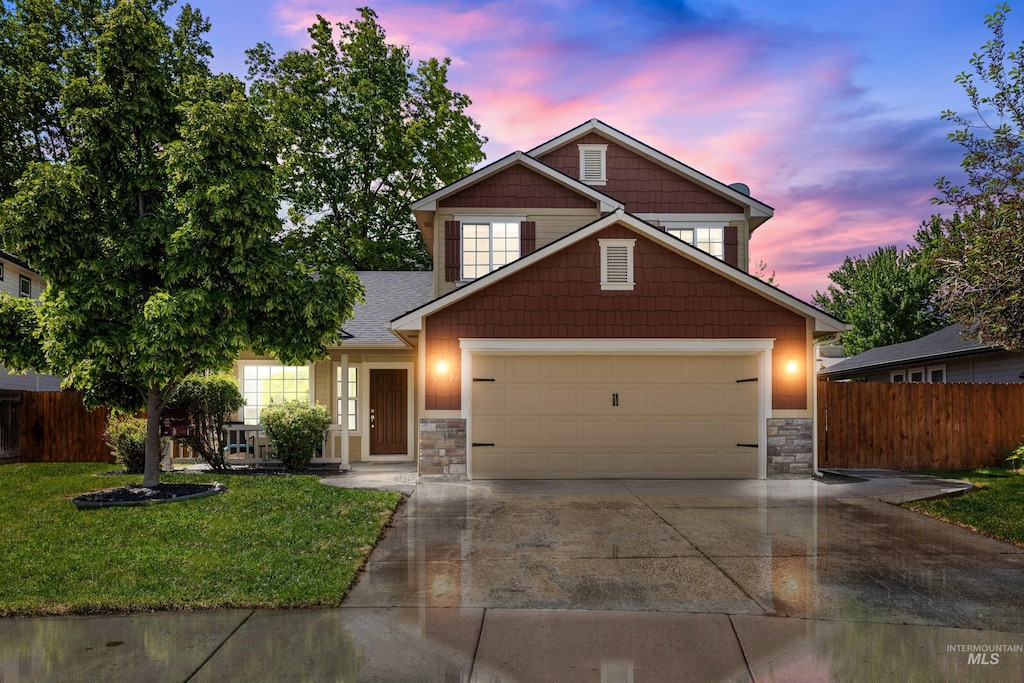 6657 W Deangelis St, Boise, ID 83714 - view of front of property with driveway, stone siding, an attached garage, and roof with shingles