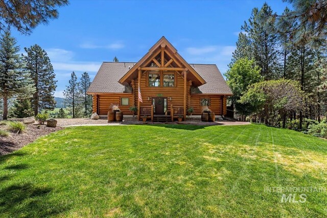 38 Blue Shadow Dr, Garden Valley, ID 83622 - rear view of property with a lawn, roof with shingles, and log exterior