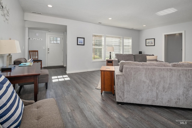 living room with dark wood-style flooring, recessed lighting, baseboards, and visible vents