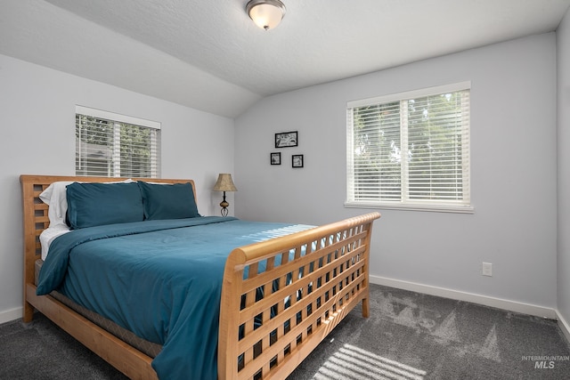 bedroom with carpet, multiple windows, lofted ceiling, and baseboards