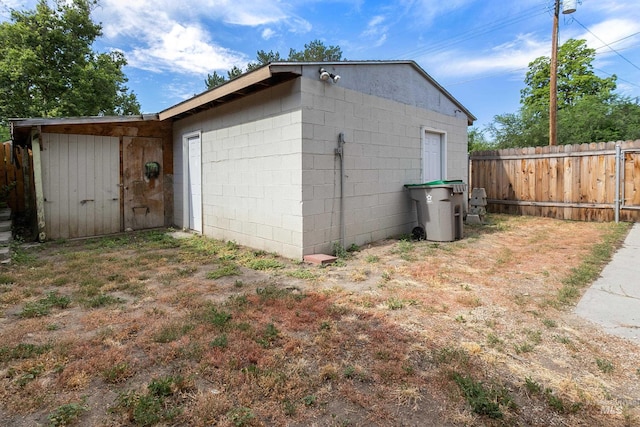 view of outdoor structure featuring fence