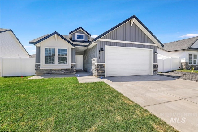 1275 Terra Ave, Twin Falls, ID 83301 - view of front of home with an attached garage, board and batten siding, stone siding, and concrete driveway