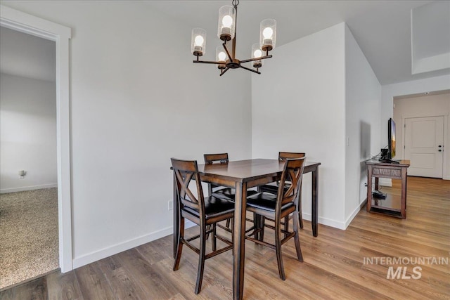 1275 Terra Ave, Twin Falls, ID 83301 - dining area featuring a chandelier and wood finished floors