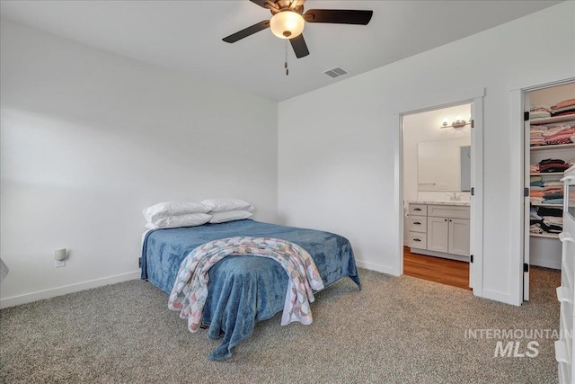 1275 Terra Ave, Twin Falls, ID 83301 - carpeted bedroom with a walk in closet, a closet, connected bathroom, and ceiling fan