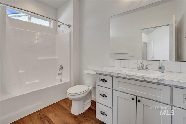 1275 Terra Ave, Twin Falls, ID 83301 - full bathroom featuring vanity, wood finished floors, and shower / washtub combination