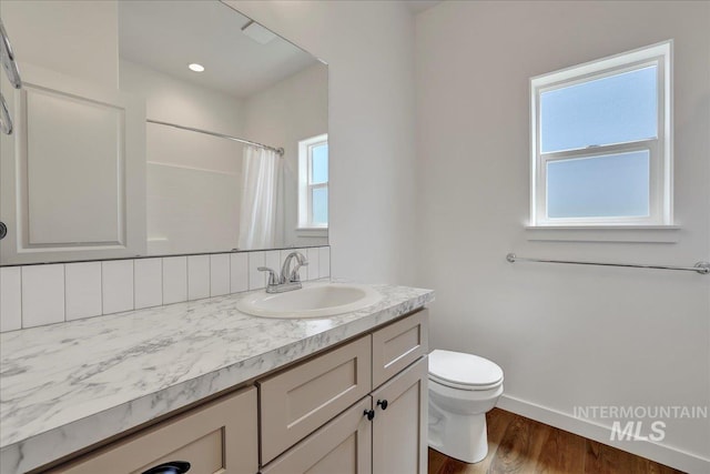 1275 Terra Ave, Twin Falls, ID 83301 - full bath with wood finished floors, vanity, and a shower with shower curtain