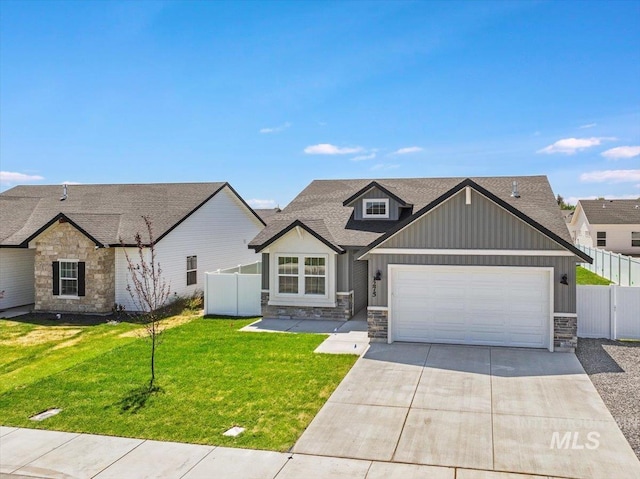 1275 Terra Ave, Twin Falls, ID 83301 - view of front of house with stone siding, concrete driveway, a garage, board and batten siding, and roof with shingles