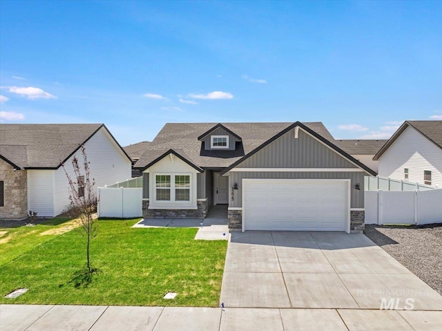 1275 Terra Ave, Twin Falls, ID 83301 - view of front of home with stone siding, concrete driveway, board and batten siding, an attached garage, and roof with shingles