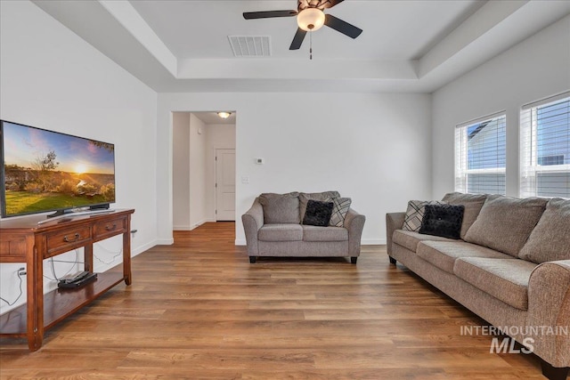 1275 Terra Ave, Twin Falls, ID 83301 - living area with a raised ceiling, a ceiling fan, and wood finished floors