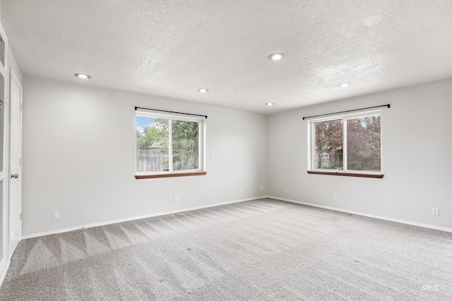 5457 S Oseola Pl, Boise, ID 83709 - spare room with carpet, a textured ceiling, recessed lighting, and baseboards