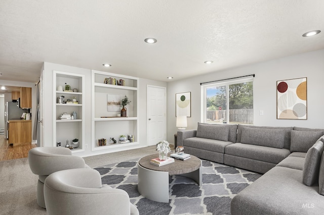 5457 S Oseola Pl, Boise, ID 83709 - carpeted living area with built in shelves, recessed lighting, and a textured ceiling