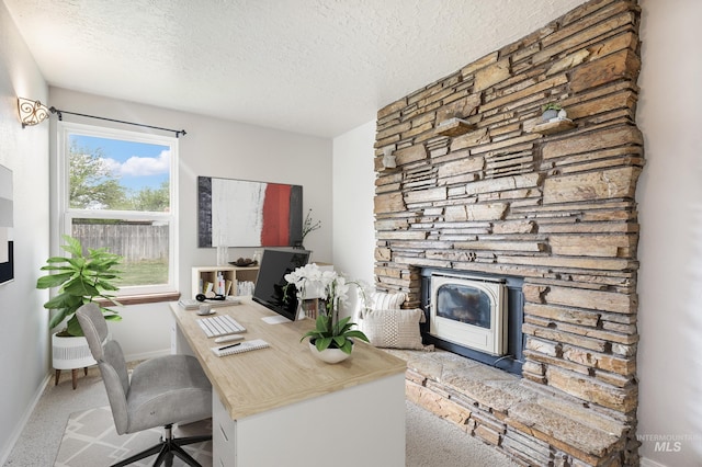 5457 S Oseola Pl, Boise, ID 83709 - carpeted home office featuring a textured ceiling, baseboards, and a wood stove
