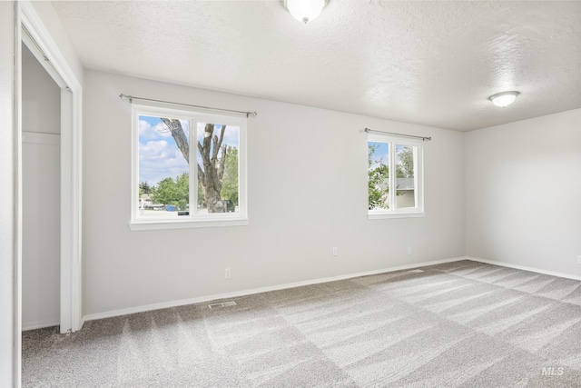 5457 S Oseola Pl, Boise, ID 83709 - unfurnished bedroom with a textured ceiling, carpet floors, baseboards, and a closet