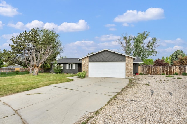 5457 S Oseola Pl, Boise, ID 83709 - mid-century inspired home with an attached garage, driveway, and brick siding