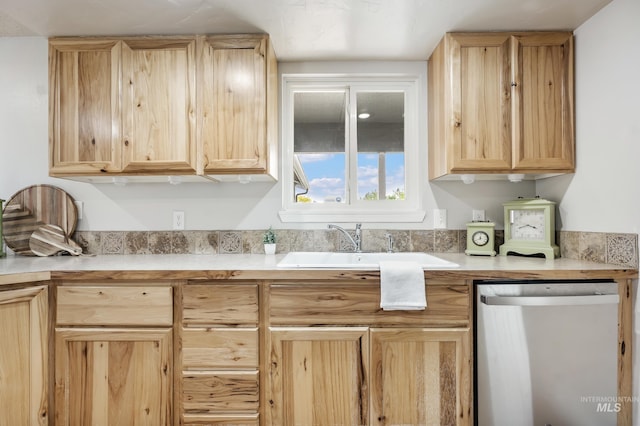 5457 S Oseola Pl, Boise, ID 83709 - kitchen featuring stainless steel dishwasher, light brown cabinetry, a sink, and light countertops
