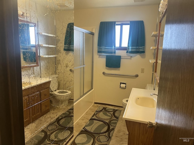 full bathroom featuring bath / shower combo with glass door, visible vents, toilet, vanity, and tile patterned floors