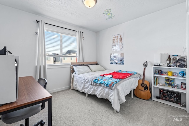 3084 N Network Ln, Boise, ID 83704 - bedroom with carpet floors, a textured ceiling, and an office area