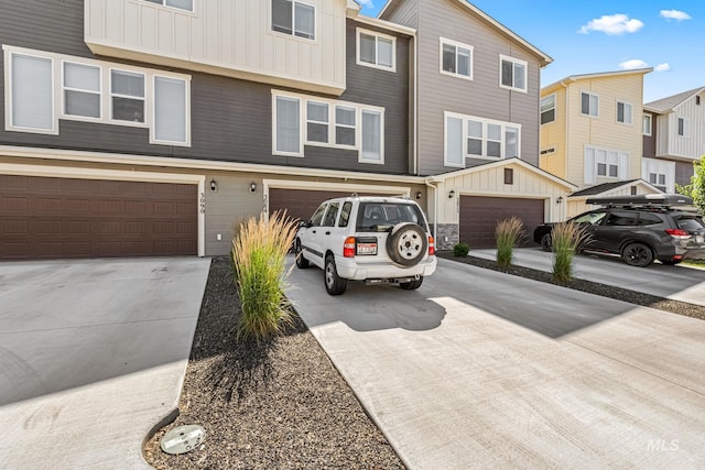 3084 N Network Ln, Boise, ID 83704 - multi unit property with board and batten siding, driveway, and an attached garage