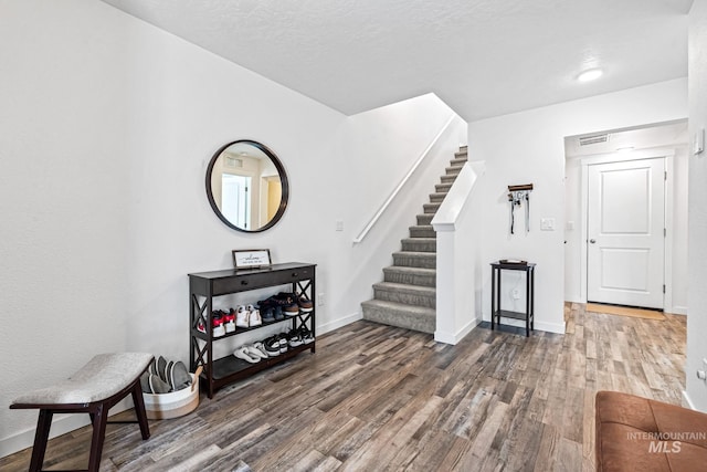 3084 N Network Ln, Boise, ID 83704 - entrance foyer featuring wood finished floors, stairway, and a textured ceiling