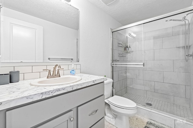 3084 N Network Ln, Boise, ID 83704 - bathroom featuring vanity, a stall shower, a textured ceiling, and decorative backsplash