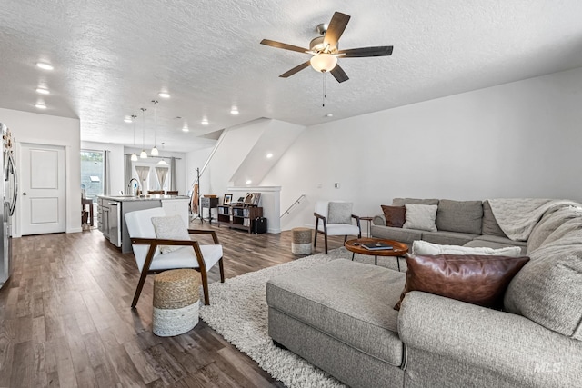 3084 N Network Ln, Boise, ID 83704 - living area with a textured ceiling, dark wood finished floors, and a ceiling fan