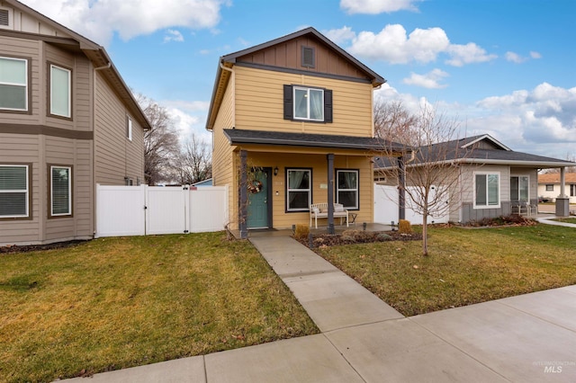 view of front property with a porch and a front yard