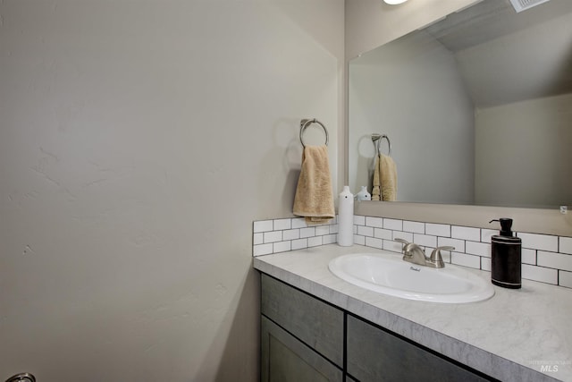 bathroom with vanity and backsplash