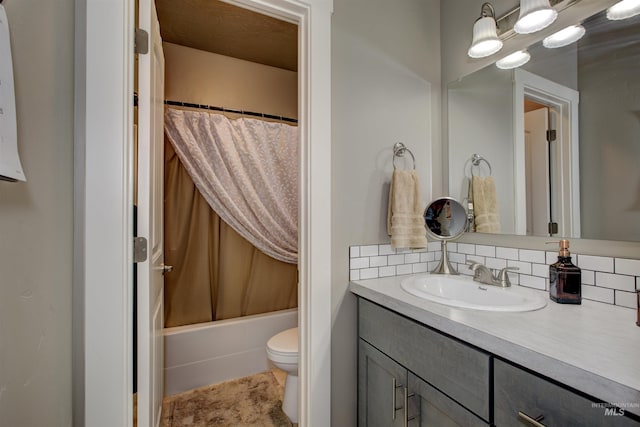 full bathroom with tasteful backsplash, vanity, toilet, and shower / tub combo