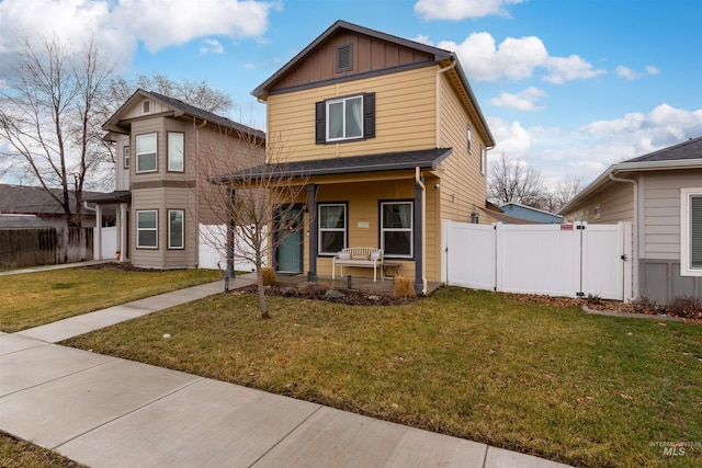 view of front of home featuring covered porch and a front yard