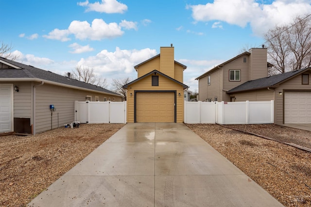 exterior space with an outbuilding and a garage