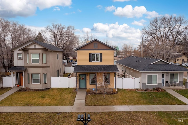 view of property featuring a front lawn