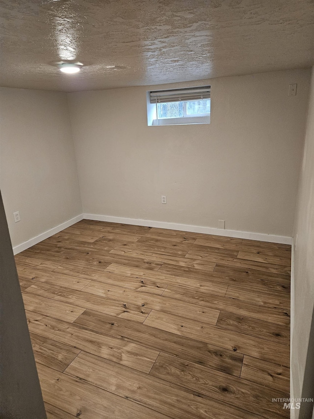 407 E Freeport St, Caldwell, ID 83605 - basement featuring wood finished floors and a textured ceiling