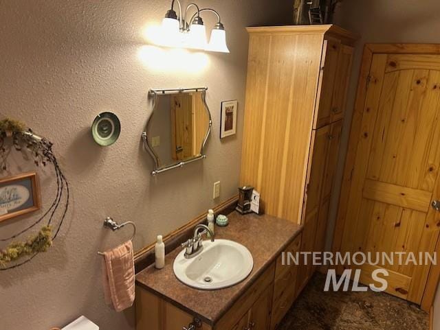 1621 Doumecq Rd, Cottonwood, ID 83522 - bathroom with vanity and a textured wall