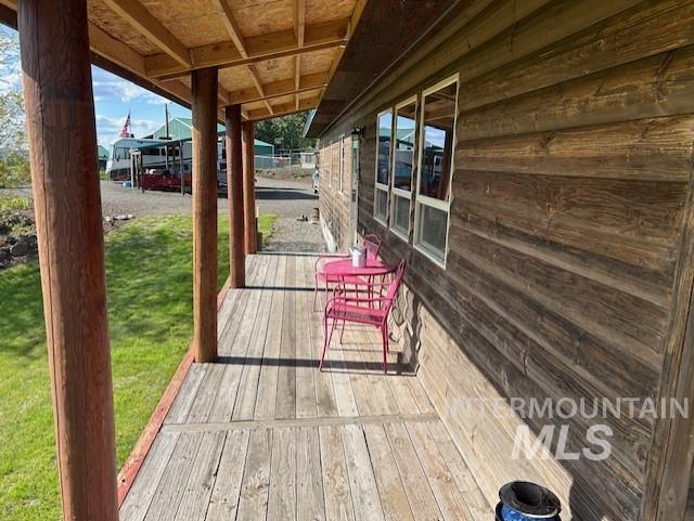 1621 Doumecq Rd, Cottonwood, ID 83522 - wooden deck featuring a yard