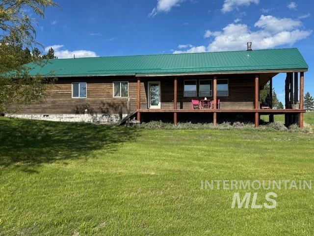 1621 Doumecq Rd, Cottonwood, ID 83522 - rear view of property featuring a yard and metal roof